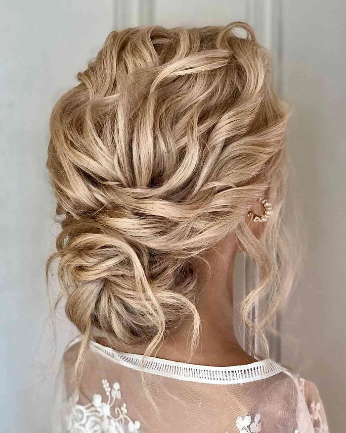 Shoulder length wedding hair half up style with soft curls and decorative hairpiece