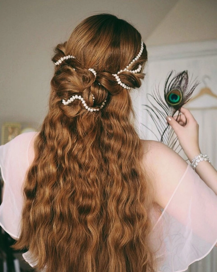 Soft romantic cottagecore wedding hair style with loose waves and floral accessories