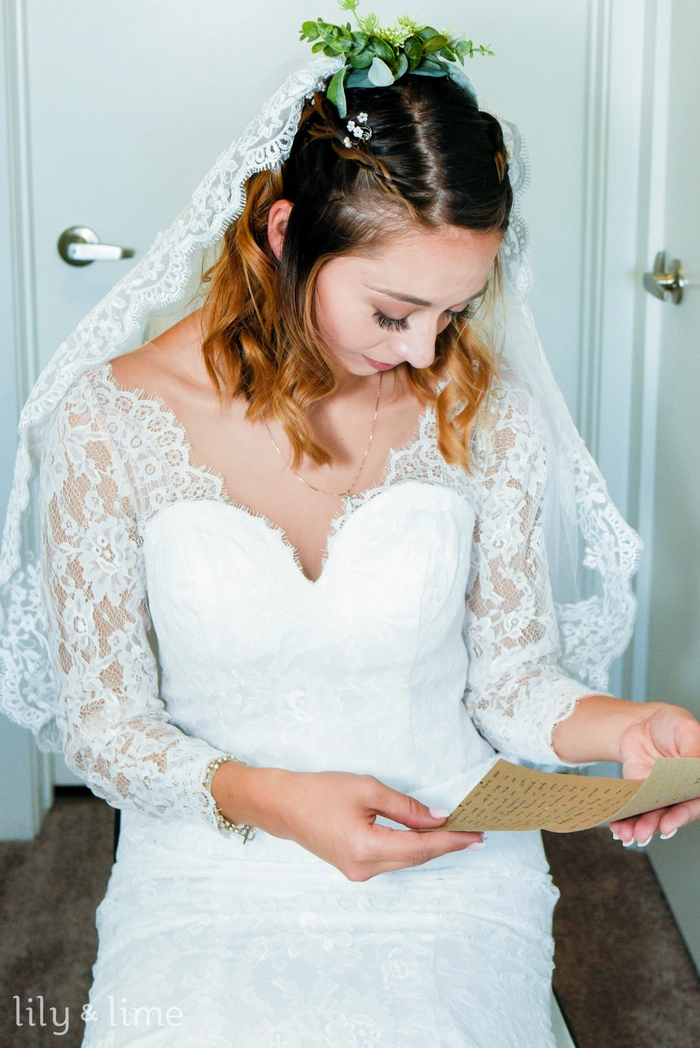 Spring garden wedding floral hair style with delicate blossoms woven into curls