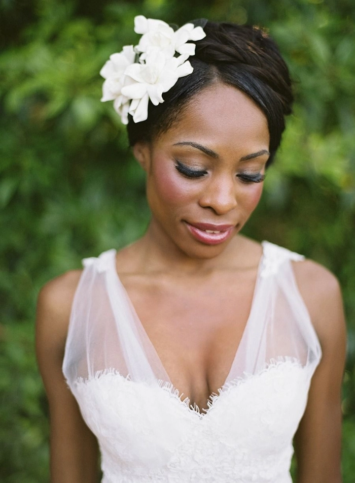 Spring garden wedding hairstyle adorned with delicate floral accents