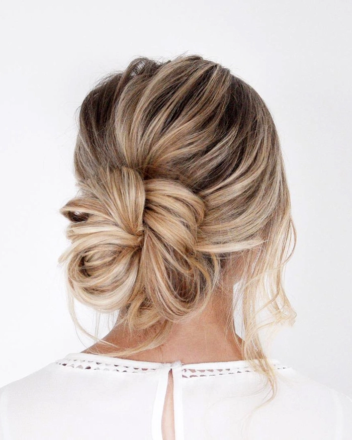 Chic and breezy hairstyle perfect for summer wedding guests Elegant summer wedding guest hair styled with soft waves and floral accessories