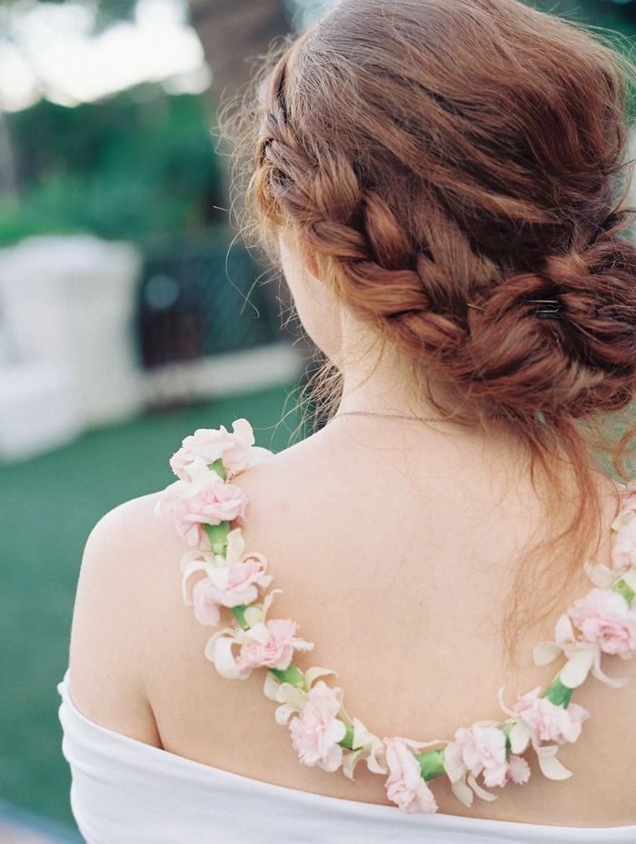 Chic bridal hairstyle perfect for tropical destination weddings showcasing natural beauty Elegant destination tropical wedding hair styled with fresh flowers and soft waves