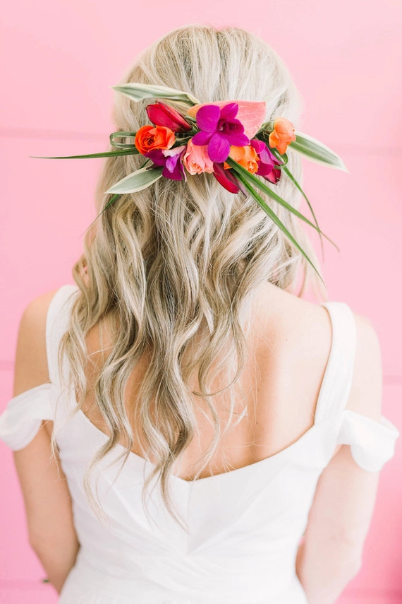 Beautiful bridal hairstyle perfect for a tropical wedding destination Elegant destination tropical wedding hair styled with fresh flowers