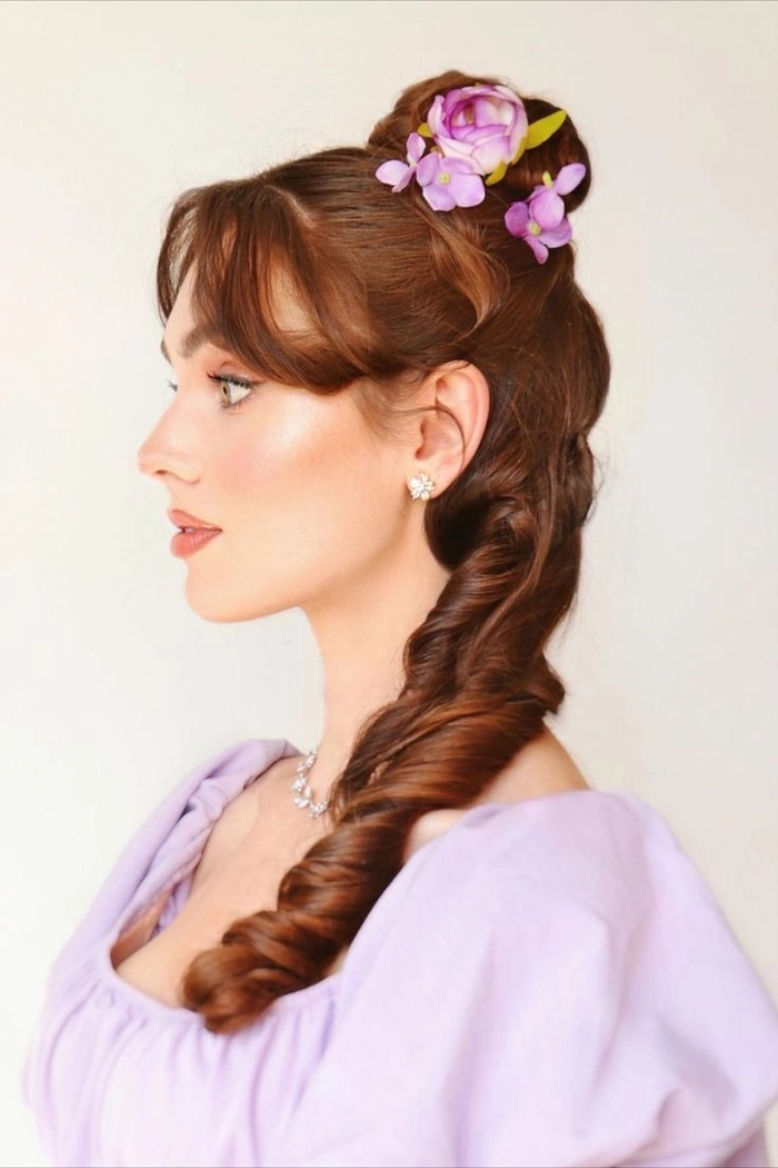 Elegant Victorian era inspired bridal hair with intricate curls and floral accents