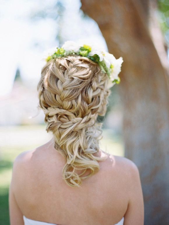 Victorian era inspired bridal hair with intricate curls and floral accents