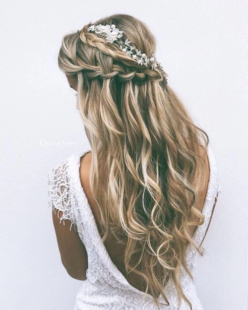 Beautiful waterfall braid wedding hairstyle perfect for an outdoor ceremony Elegant waterfall braid wedding hair styled for a bride with soft curls