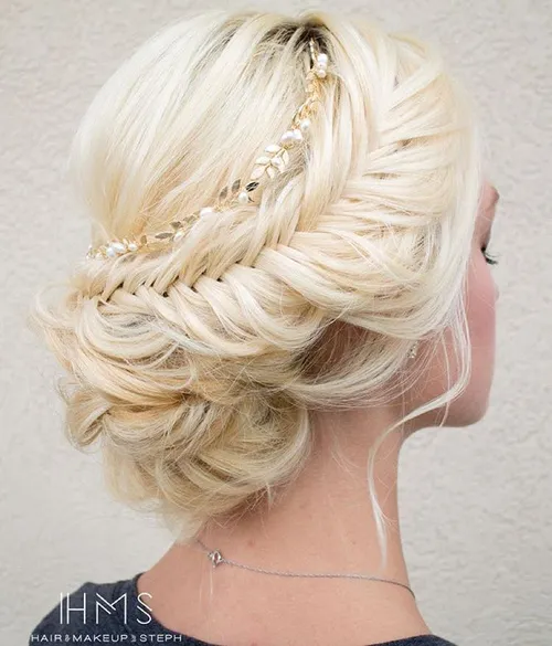 Beautiful bridal fishtail braid updo hairstyle for special occasions Elegant wedding hair fishtail braid updo with delicate floral accents
