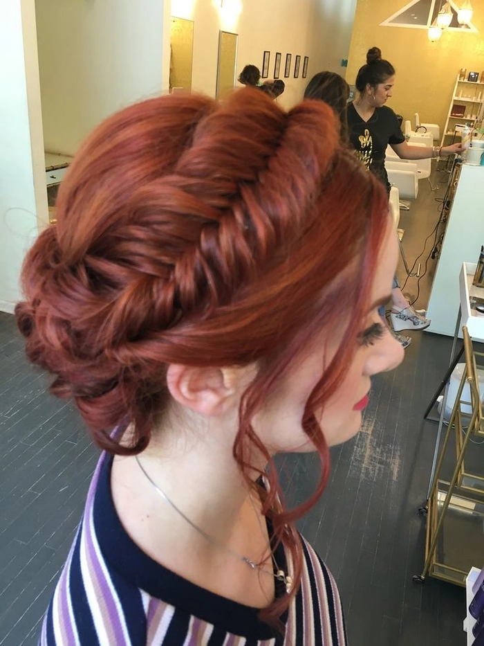 Chic fishtail braid updo hairstyle perfect for brides and special occasions Elegant wedding hair fishtail braid updo with delicate floral accents