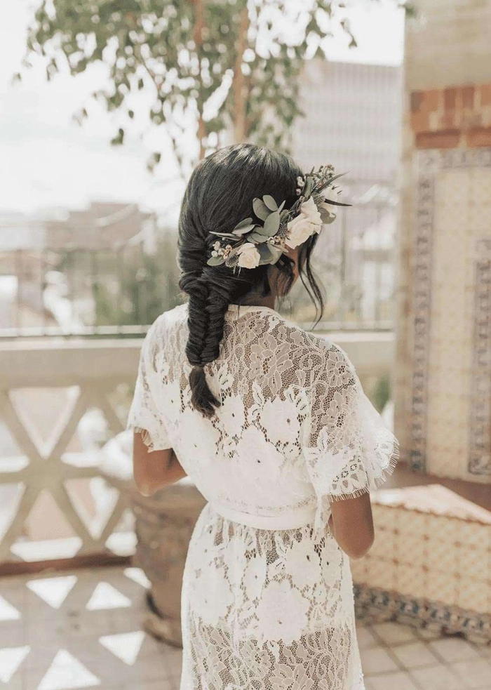 Chic fishtail braid updo perfect for bridal hairstyles on your special day Elegant wedding hair fishtail braid updo adorned with delicate floral accessories