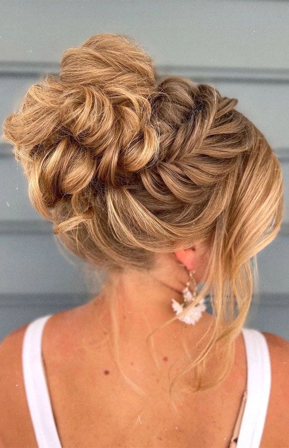 Elegant fishtail braid updo wedding hairstyle perfect for any bridal look Wedding hair fishtail braid updo styled elegantly for a bride