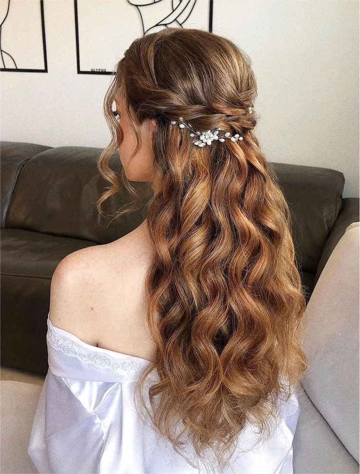 Elegant bridal hairstyle featuring an intricate braided crown for weddings Beautiful wedding hair braided crown styled with delicate flowers