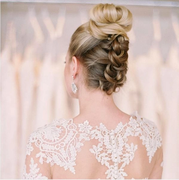Wedding Hairstyles Inspiration for a Backless Dress Look Image 5 Elegant wedding hair styled for a backless dress with soft curls and an updo