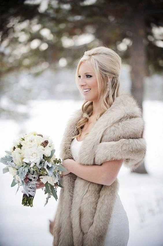 Elegant winter wedding hair adorned with chic faux fur accessories for a cozy look