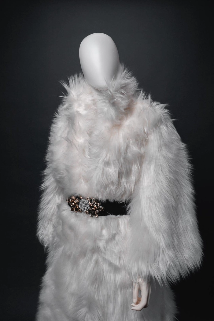 Elegant winter wedding hairstyle adorned with delicate faux fur accessories