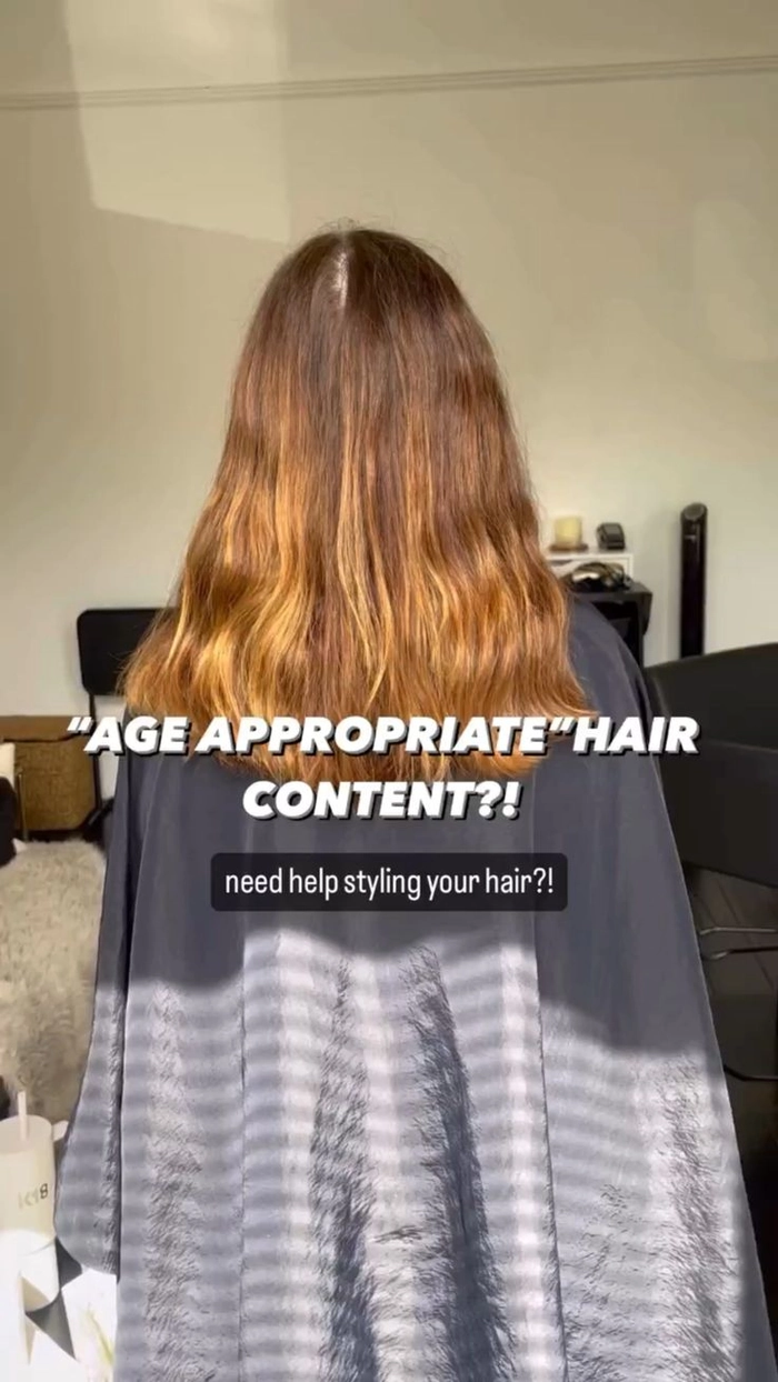 Corporate leader with subtle gray-to-blonde hair color transition for age-appropriate professional style