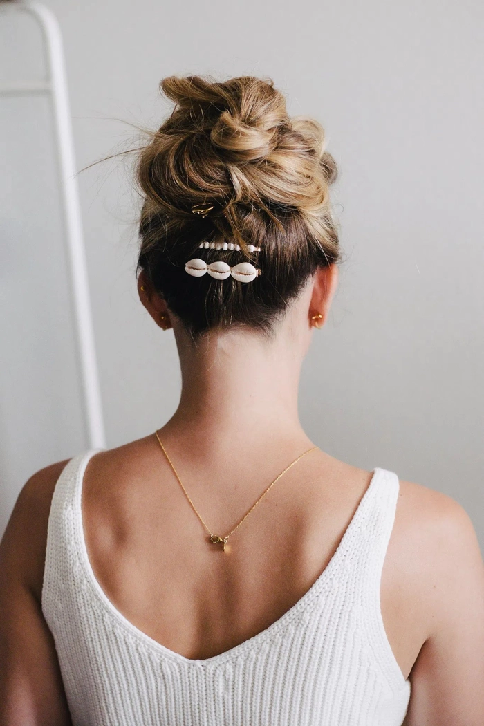 Medium length office hair styled with layered barrette stacking techniques