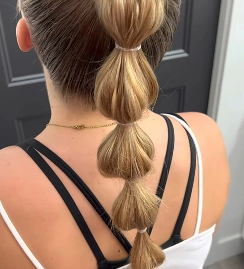Step-by-step bubble ponytail techniques for a modern office look