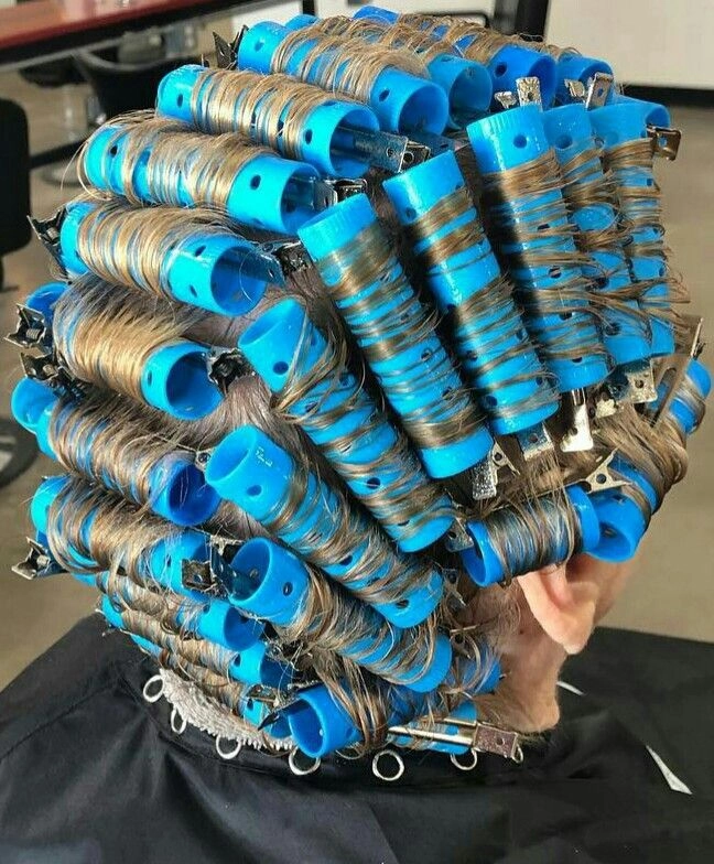 Classic roller set hairstyle for mature women in a professional business setting