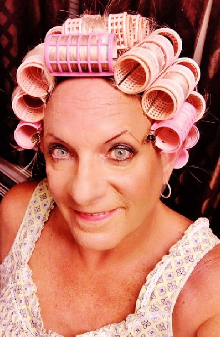 Mature businesswoman with a classic roller set hairstyle, looking professional