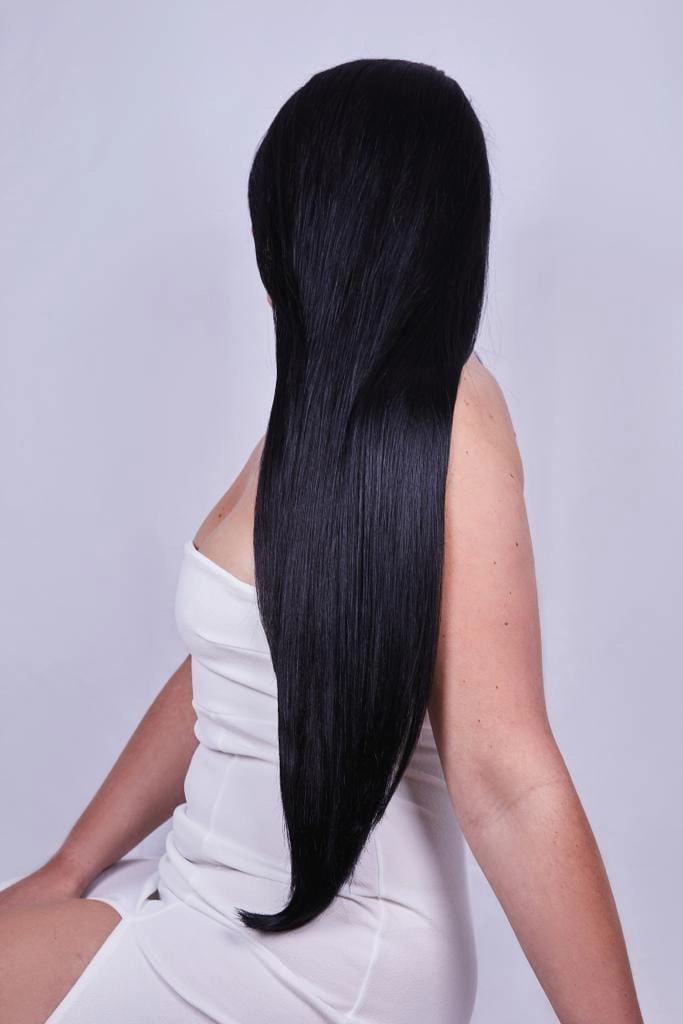Coarse hair smoothing techniques for professional work hairstyles under corporate dress codes Professional woman with smoothed coarse hair styled in a sleek low bun for corporate dress code compliance