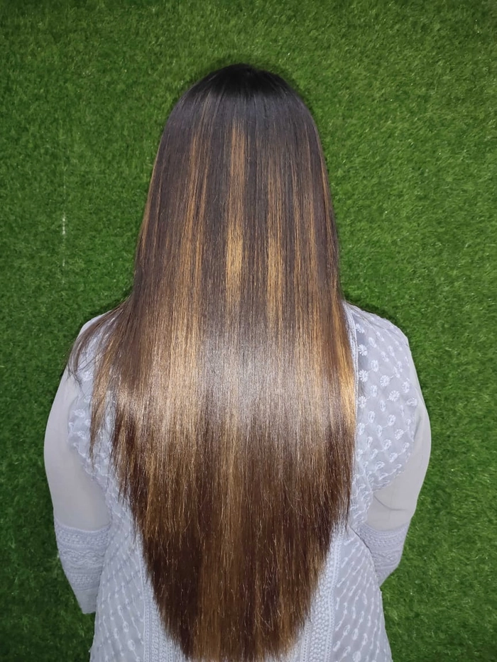How to achieve sleek, frizz-free coarse hair for professional work environments Professional woman with smoothed coarse hair styled in a low bun, suitable for corporate dress codes