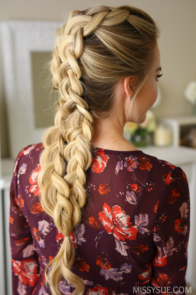 Woman with double dutch braids working in an active environment
