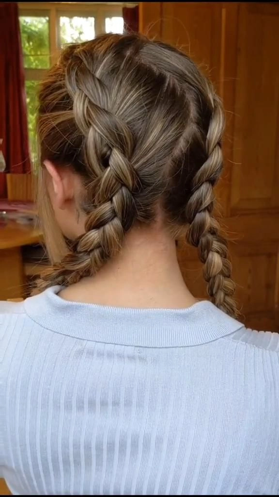 Active woman with neat double dutch braids in a workplace setting