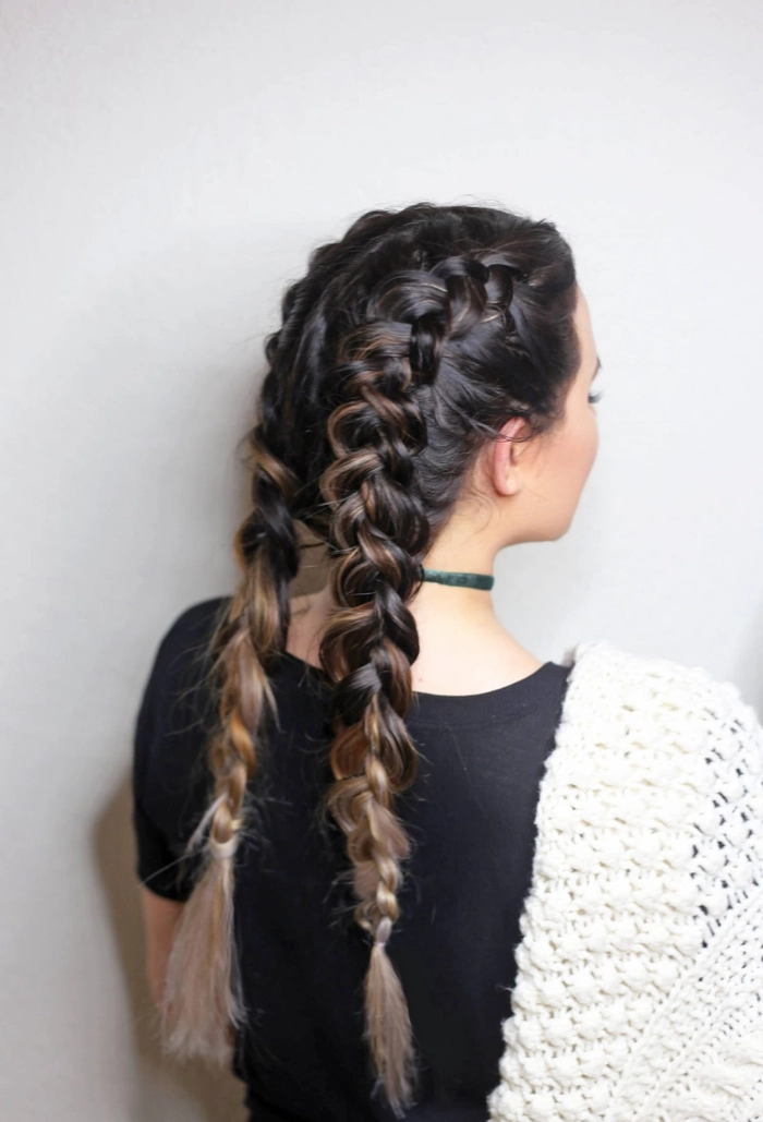 Woman wearing double dutch braids for an active work environment