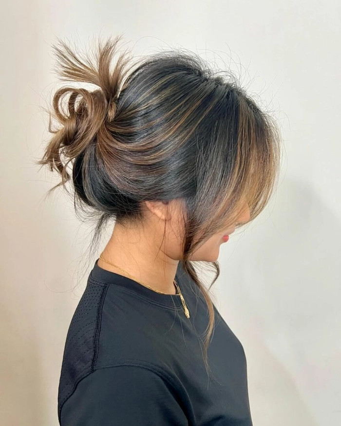 Professional messy bun hairstyle for work, effortless yet polished