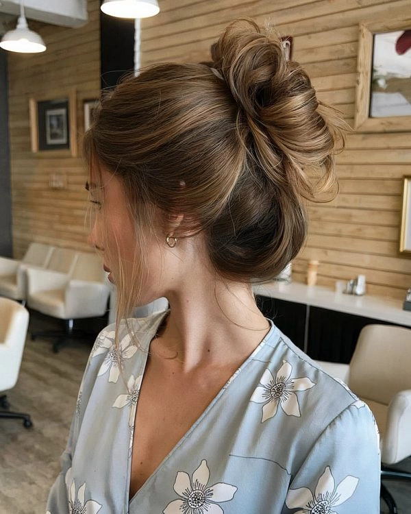 Elegant French Twist for Corporate Occasions An elegant French twist variation with a sleek finish, perfect for formal corporate events
