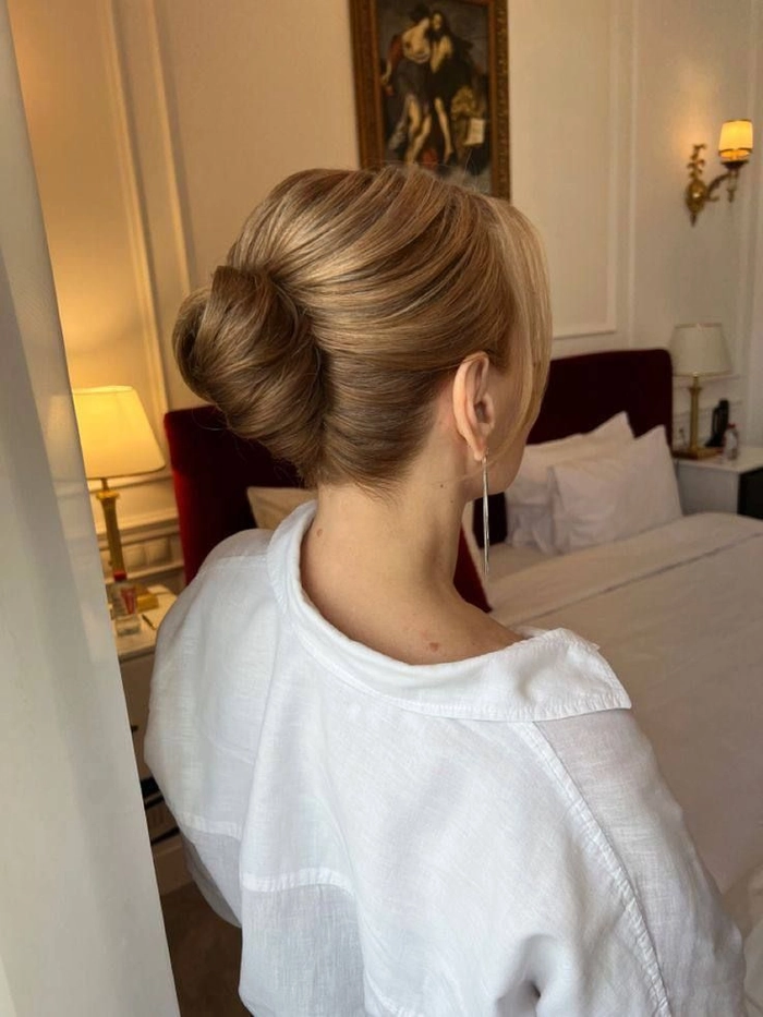 Elegant French Twist Variations for Corporate Events - Work Hairstyle Idea Elegant French twist variations for corporate events: a polished updo featuring sleek sides and a twisted chignon