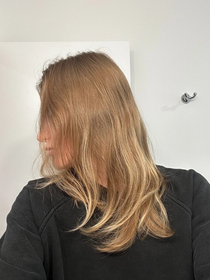 Textured volume work hairstyle for fine hair professional office look Woman with fine hair texturized for volume in an office hairstyle