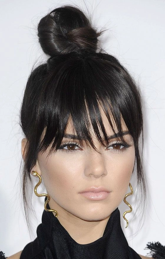 Professional fringe hairstyle covering the forehead for a polished work look