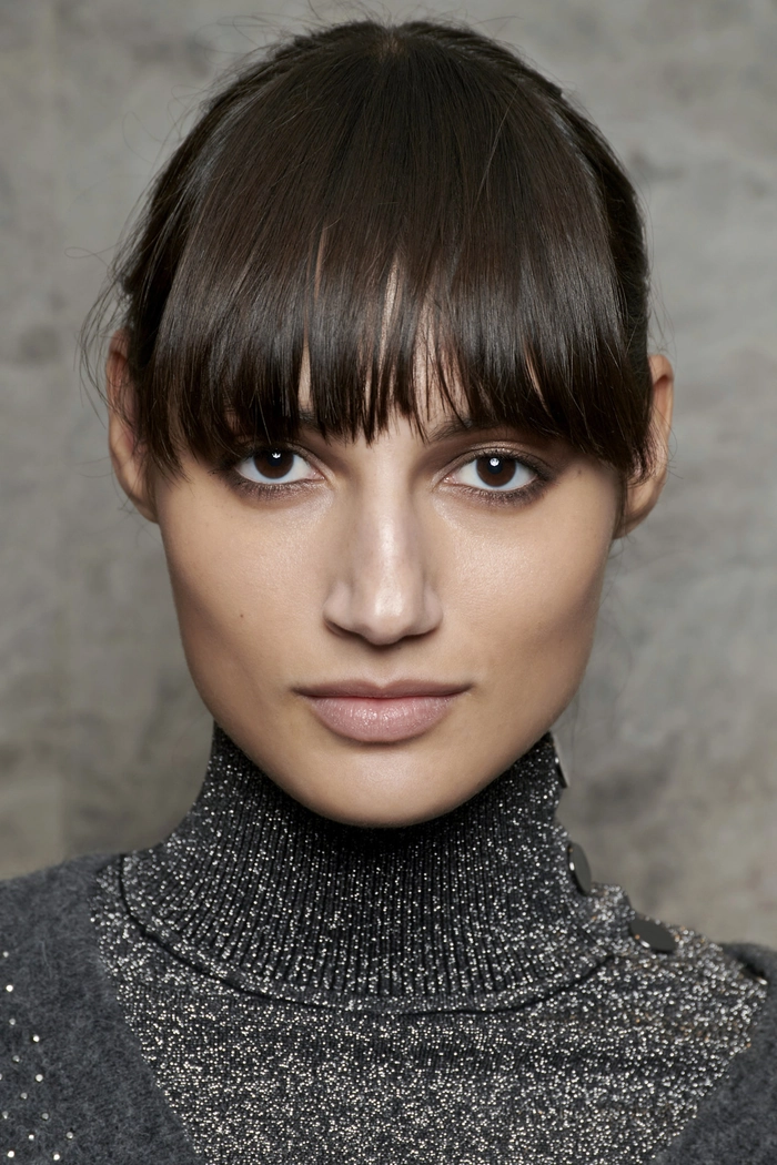 Professional fringe hairstyle covering the forehead for a polished work look