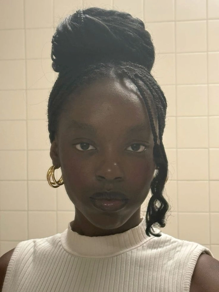 Hair containment style for laboratory technicians: neat bun with cap
