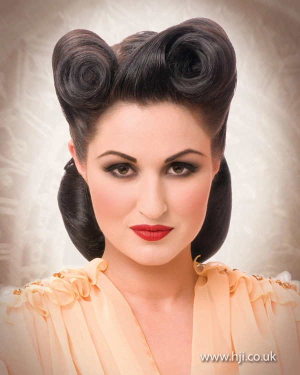 Elegant rolled vintage victory rolls hairstyle suited for a retro themed work event