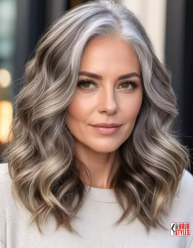 Corporate leader with professional hairstyle showcasing subtle gray to brunette hair color transition