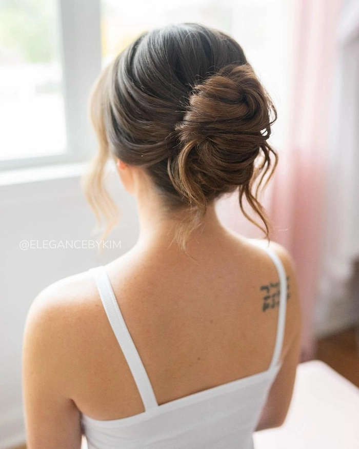 Sophisticated French twist variation styling for the office Elegant French twist updo with a sleek side part for a professional corporate event