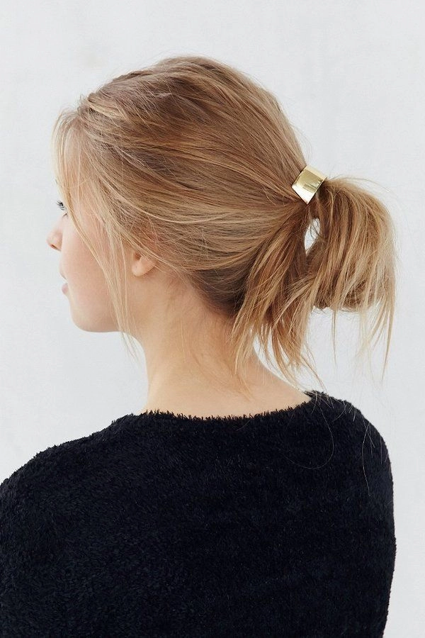 minimalist hairpin placements along a sleek office bun for a polished professional look