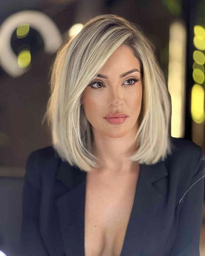 Professional woman with a jawline-highlighting bob for heart-shaped faces at work