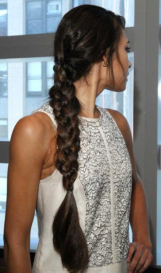 Long hair braided into an elegant updo for a cool office look