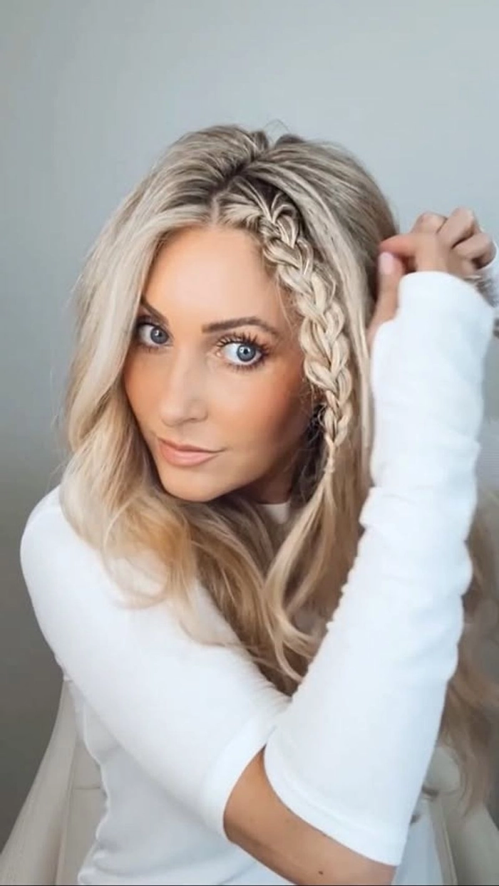 Long hair braided into a neat updo to keep cool in a hot office environment