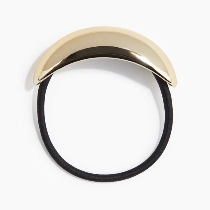 How to style a metal hair cuff for a polished work ponytail Sleek corporate ponytail fastened with a metal hair cuff in a professional office setting