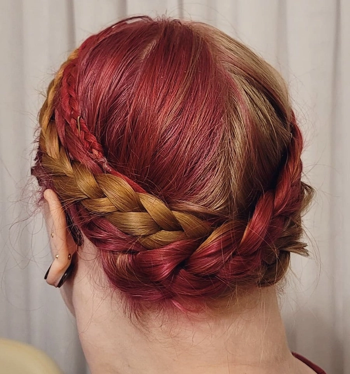 Elegant milkmaid braid bun perfect for casual workplace Fridays Milkmaid braid adaptation styled into a low twisted bun for a business casual Friday office look