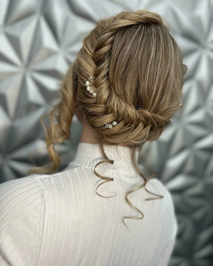 Milkmaid braid adaptation perfect for business casual Fridays in the workplace A woman in business casual attire with a milkmaid braid styled for a relaxed Friday office look