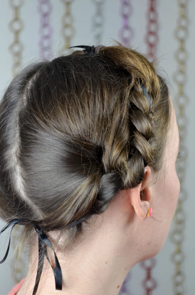 Milkmaid braid with soft waves perfect for business casual settings Two braided sections wrapped around the crown for a polished Friday office look