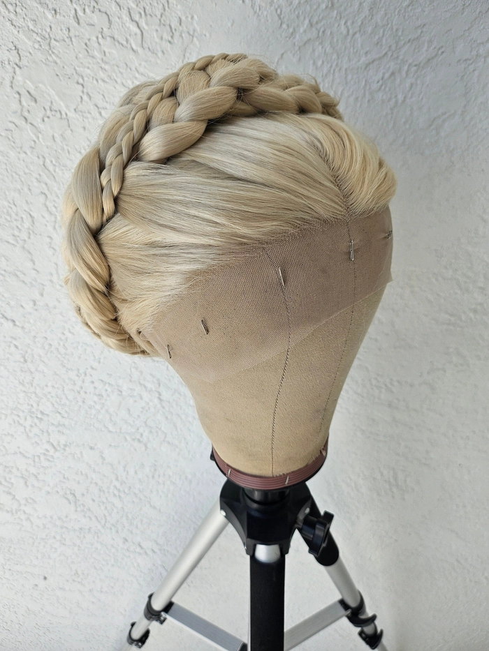 A neat braided crown hairstyle styled for a conservative workplace