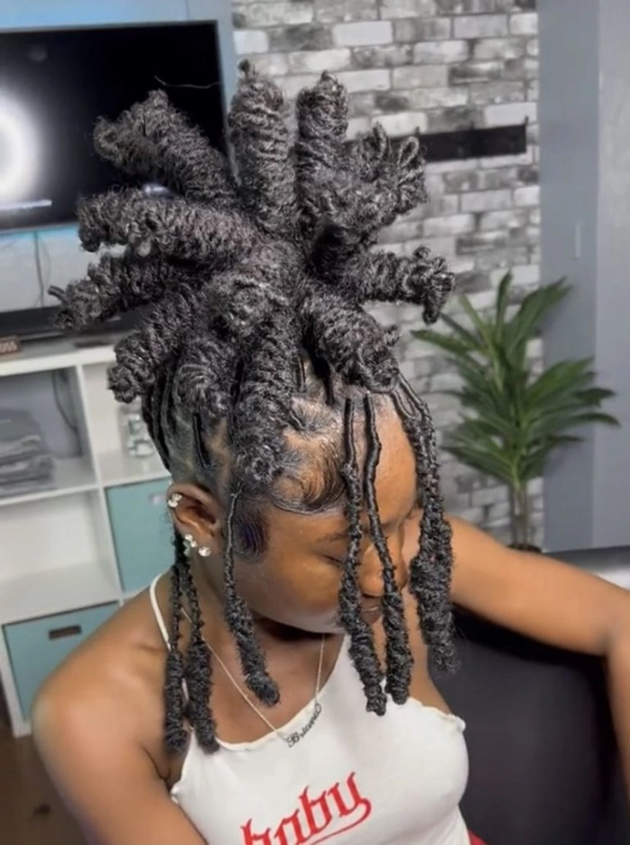 Professional loc updo for corporate workplace style Neat loc updo hairstyle for a business meeting