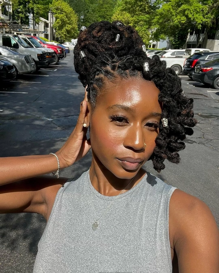 Neat loc updo hairstyle suitable for professional work meetings neat loc updo pinned elegantly for a business meeting