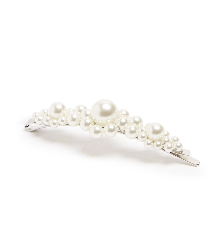 Pearl hair clips artfully arranged for a polished corporate presentation hairstyle